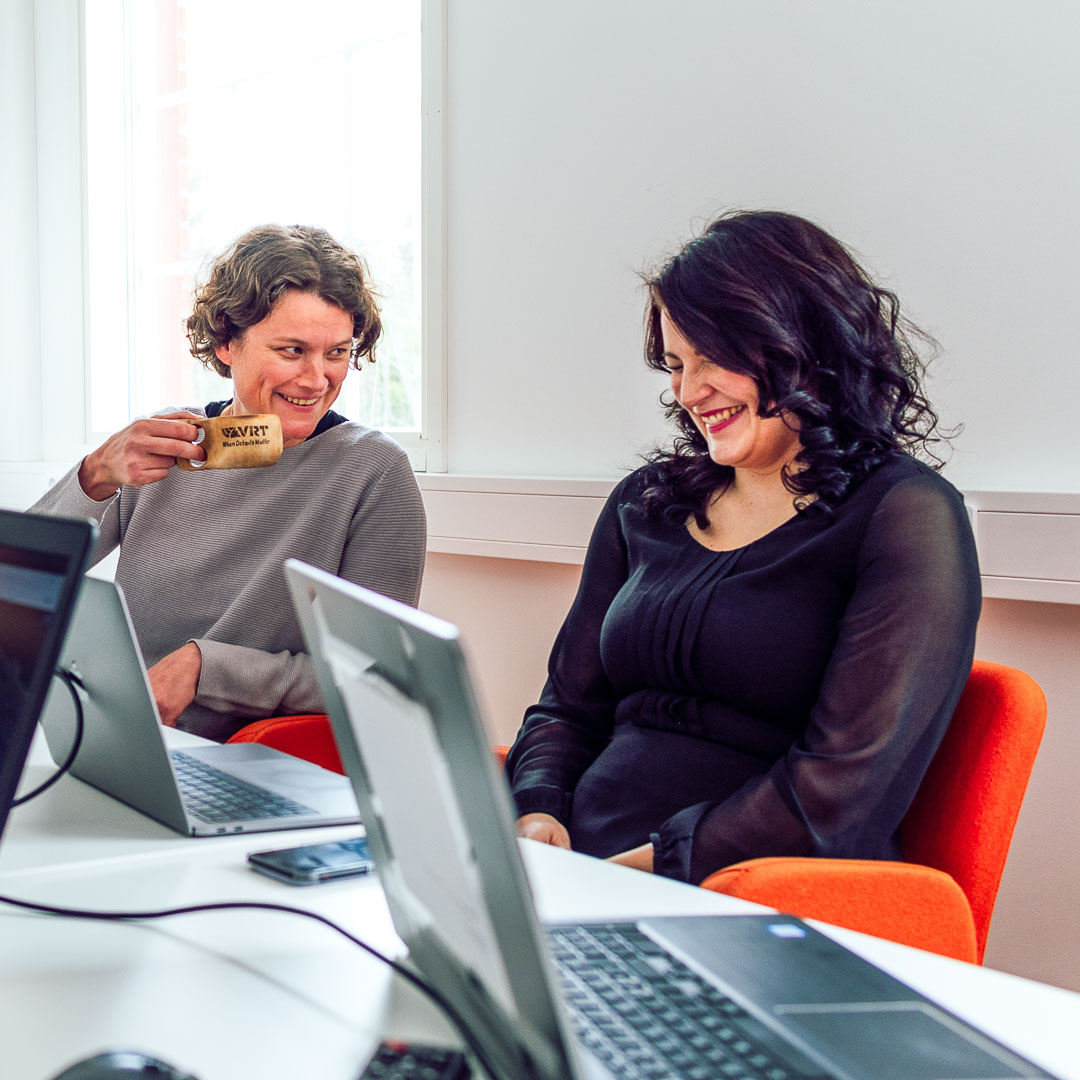 Two women working with computers.
